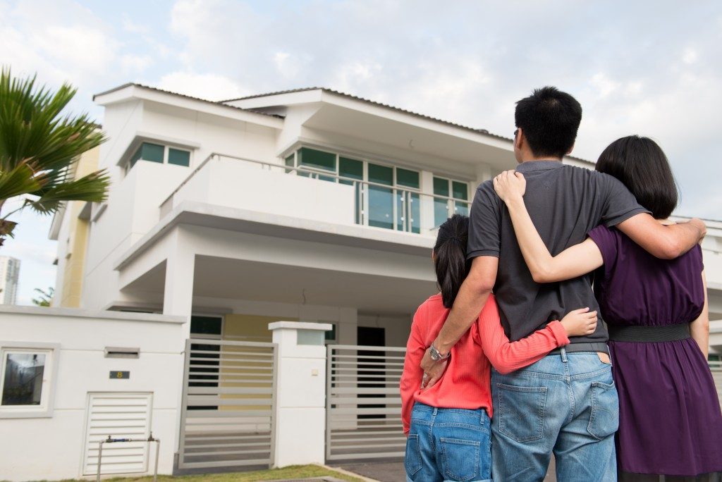 family looking at their new home