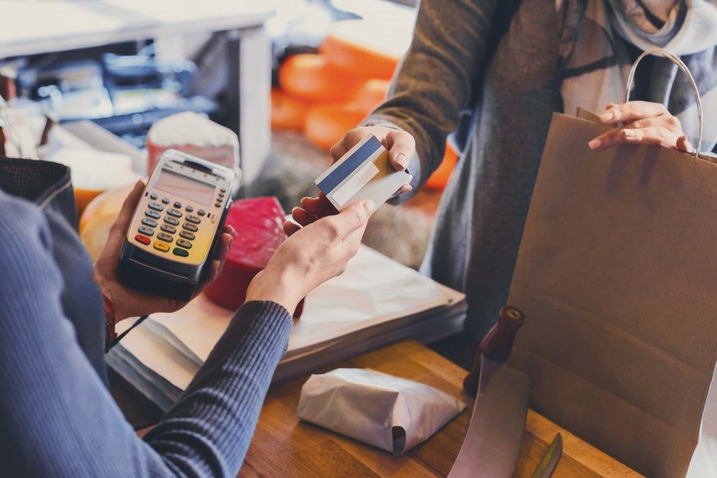 Woman paying with a credit card