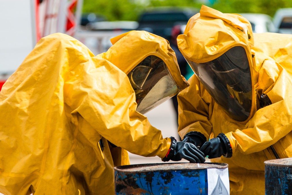 Two people wearing safety gear