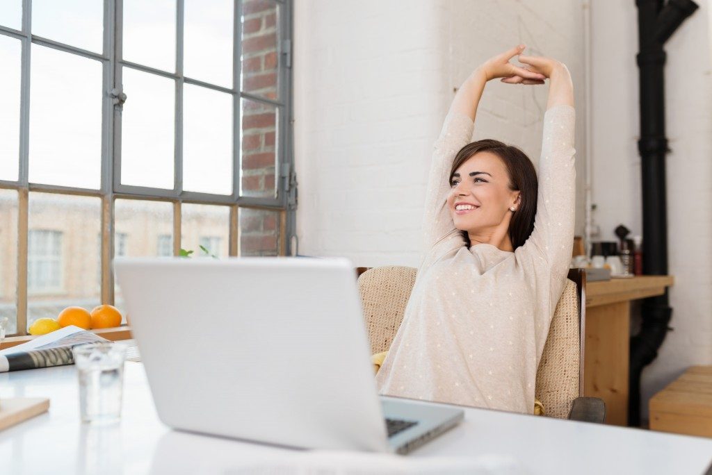 woman relaxing at her office