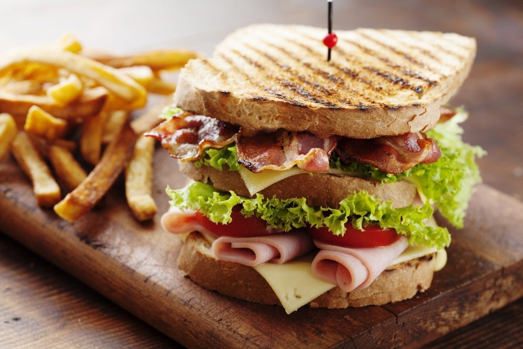 Club sandwich and fries served