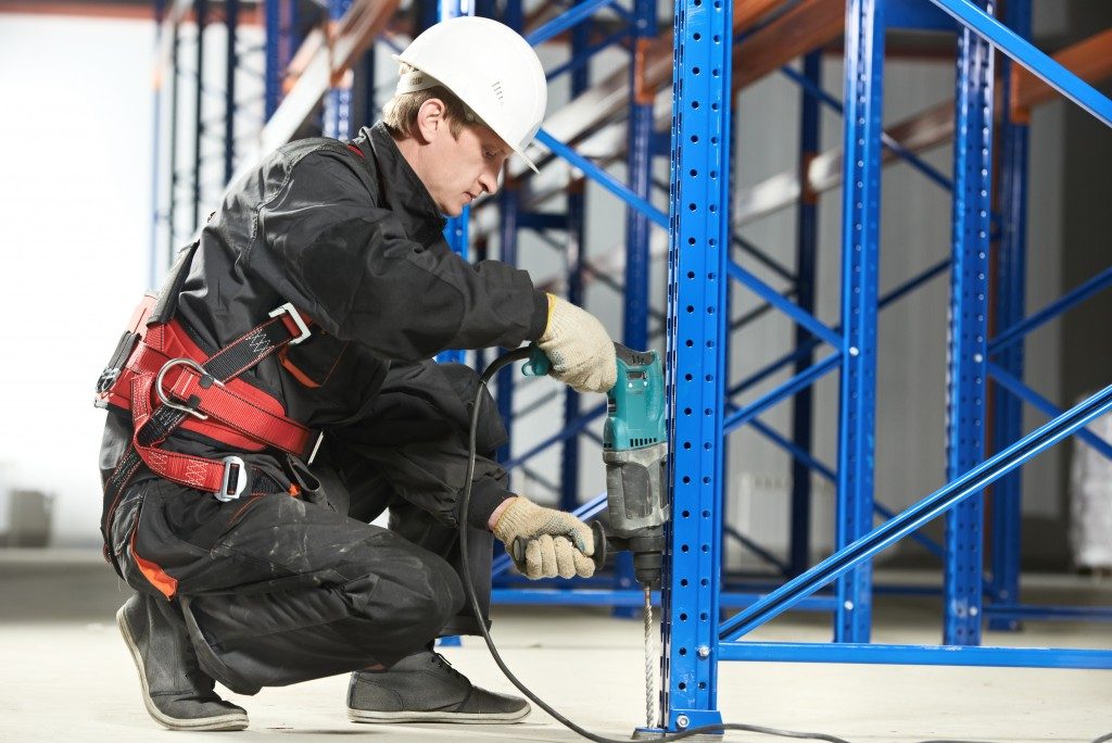Worker installing a mezzanine floor