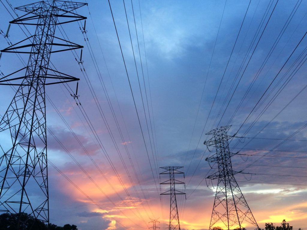 power transmission towers at dawn