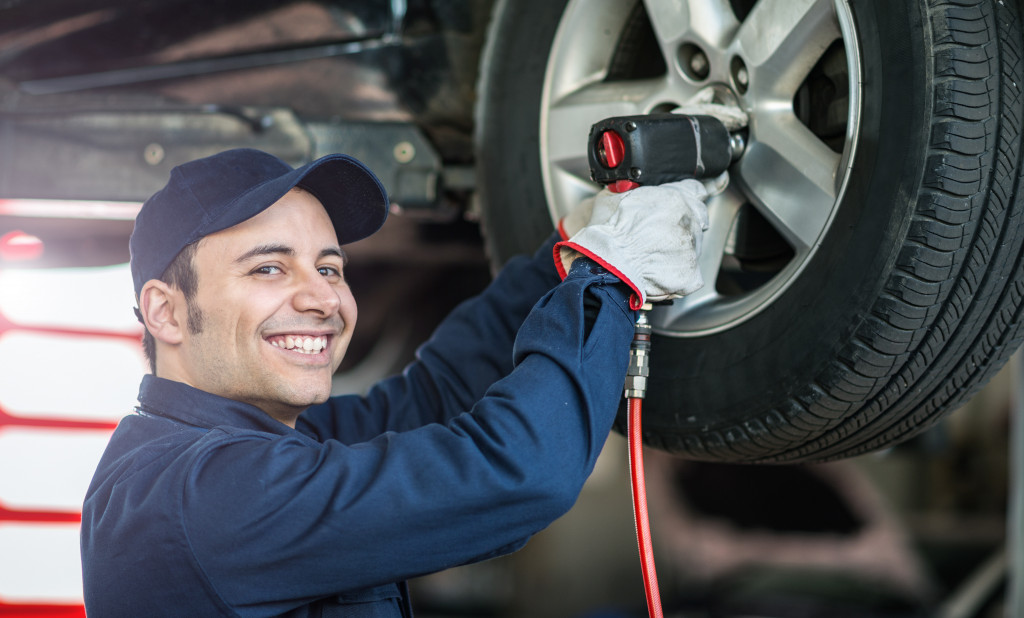 man fixing the tire