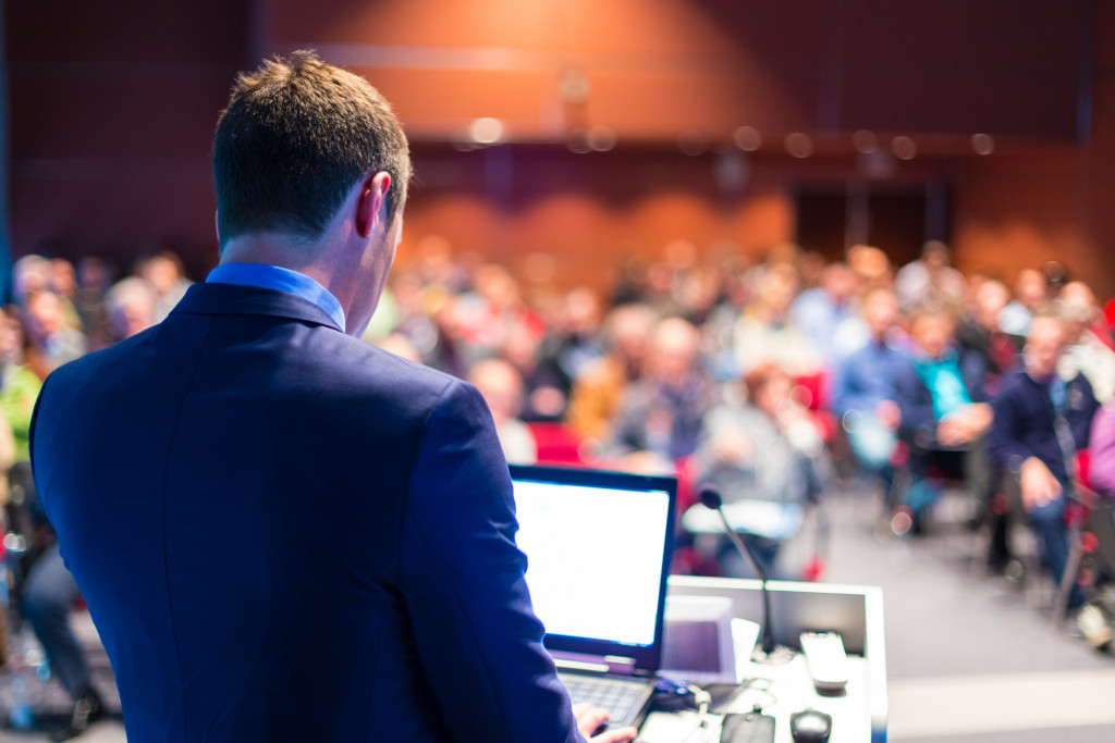 Speaker at Business Conference and Presentation. Audience at the conference hall.