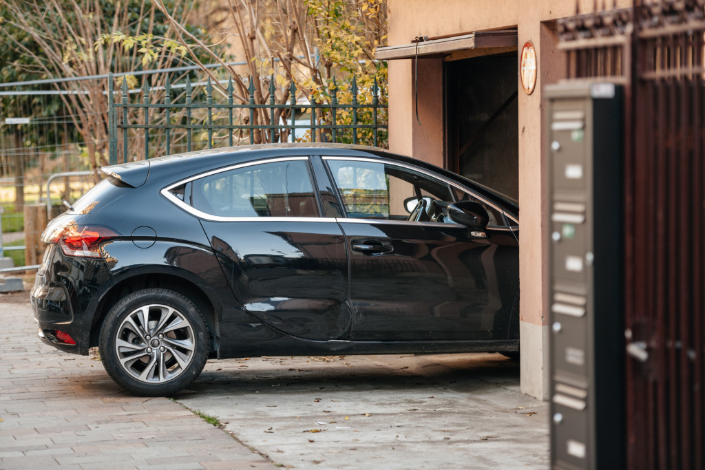 Detail of a car entering through garage door