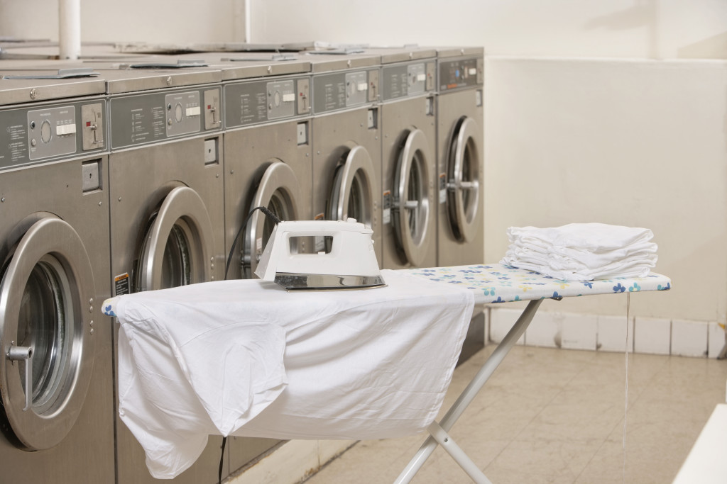 Ironing board with washing machines in Laundromat