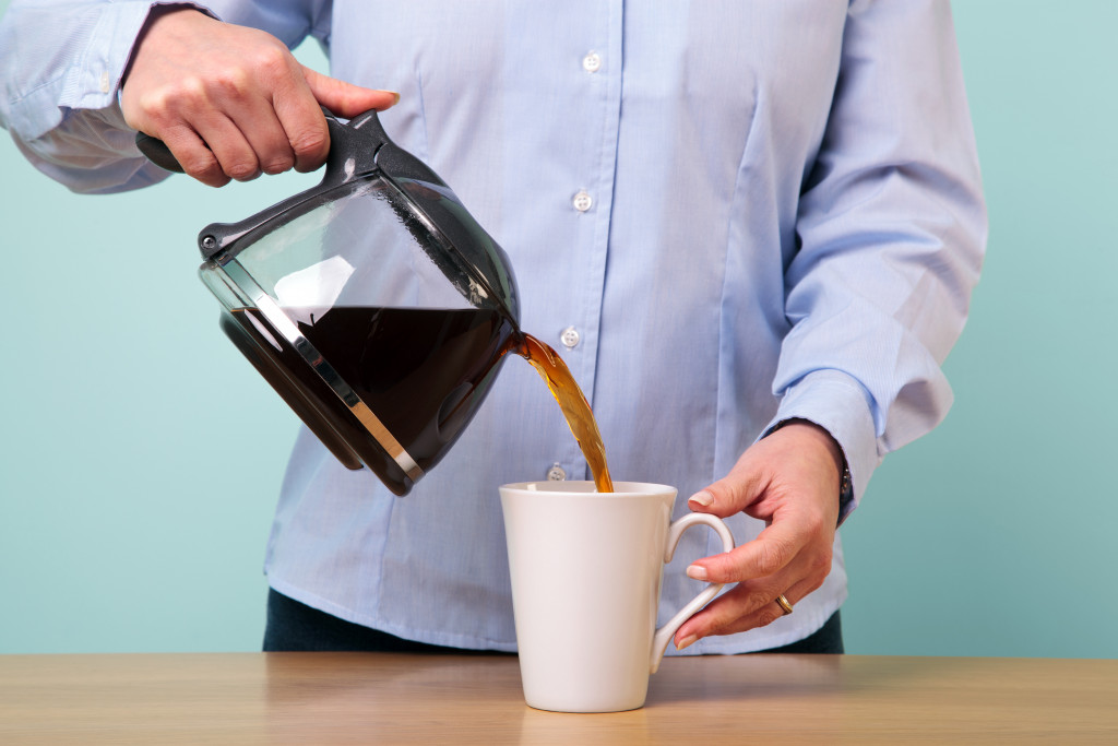 man pouring coffee