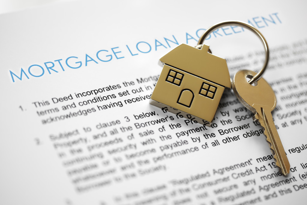 mortgage loan agreement application with house shaped key ring