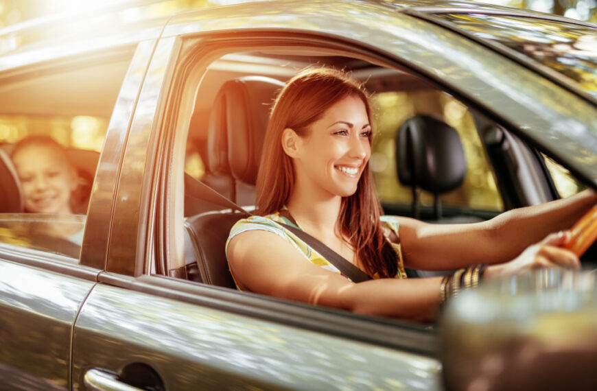 woman driving the car smiling