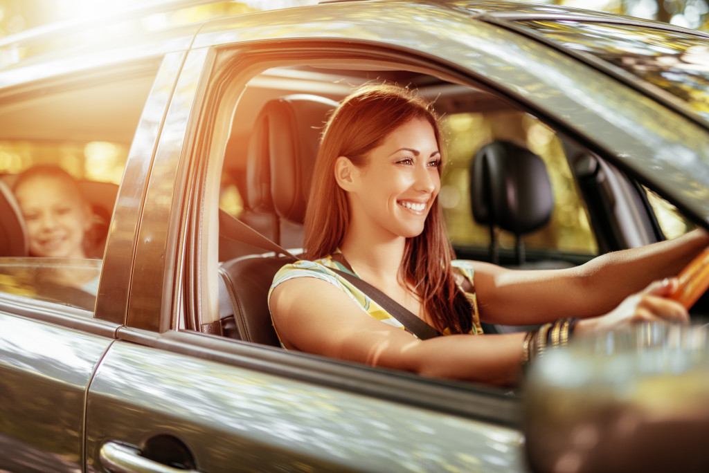woman driving the car smiling